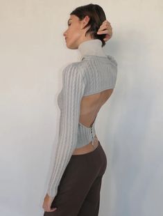 Long-sleeved knitted top with draped neck and open back. Each piece can have different dye shadowing. High Neck Long Sleeve Top, Poor Things, Backless Sweater, Street Style Aesthetic, Paloma Wool, Fabric Construction, Knitwear Fashion, High Neck Long Sleeve, Knitted Top