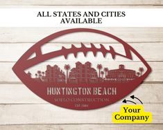 an oval metal sign with the words huntington beach on it and a cityscape