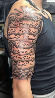 An upper arm tattoo with a poignant script that flows into an artful composition. The words “For though I fall, I will rise again. Though I sit in darkness, the Lord will be my light.” are emblazoned over a backdrop of billowing clouds and a guiding compass, symbolizing steadfast faith and unwavering direction in life’s journey.  #uppershouldertattoo #uppershouldertattoomen #shouldertattoomen #mentattoos #tattooideas  Upper Shoulder Tattoo,Upper Shoulder Tattoo Men,Upper Shoulder Tattoo Men Ideas,Upper Shoulder Tattoo Men Ideas Design,Upper Shoulder Tattoo Men Half Sleeves,Upper Shoulder Tattoo Men Small,Upper Shoulder Tattoo Men Black,Upper Shoulder Tattoo Designs Men,Upper Shoulder Tattoo Men Ideas Small Tattoo Designs Men Shoulder Ideas, Though I Fall I Will Rise Again Tattoo, Shoulder Bicep Tattoo Men, Shoulder Half Sleeve Tattoo Men, Tattoo Ideas For Men Shoulder Sleeve, Meaningful Shoulder Tattoo Men, Right Shoulder Tattoo Men, Shoulder Tattoo Men Sleeve, Men’s Tattoo Arm