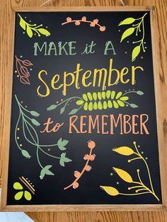 a chalkboard with the words make it a september to remember written in bright colors