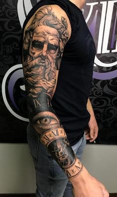 a man with a tattoo on his arm