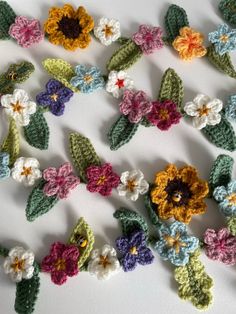 crocheted flowers arranged on top of each other