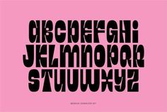 the letters are black and white on a pink background, which is also in different font styles