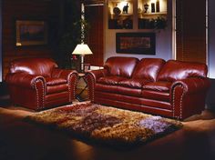 a living room with two couches and a rug