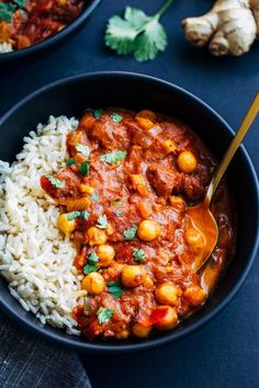 a bowl filled with rice and chickpeas next to a spoon on top of it