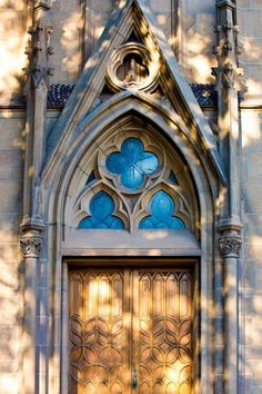 the front door to an old church with stained glass