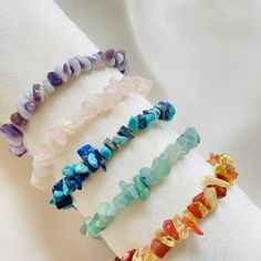 Crystal Chip Bracelet, Healing Crystal Chip Bracelet, Gemstone Chip Beads Bracelet, Chakra Crystal Healing Chip, Bracelet Gift for Women A crystal chip bracelet is a piece of jewelry made up of tiny, irregularly shaped crystals. The crystals are usually made of semiprecious stones, such as quartz or amethyst, and are cut into tiny, flat chips. Crystal chip bracelets are often worn for their decorative value and are believed by some to have healing or spiritual properties. They may be worn alone Crystal Bracelet With Round Beads As Gift, Round Crystal Bead Bracelet As Gift, Healing Natural Stone Bangle Crystal Bracelet, Healing Natural Stones Crystal Bangle Bracelet, Healing Natural Stone Crystal Bangle, Beaded Bracelets With Stones As Gifts, Beaded Bracelets With Round Stones For Gifts, Gift Beaded Bracelets With Round Stones, Spiritual Beaded Bracelets With Stones As Gift