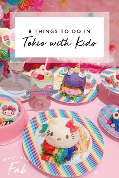 hello kitty themed birthday party with lots of plates and food on the table, including cake