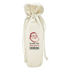 a wine bag with a santa clause on it and the words, he needs you when you're drinking