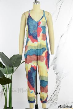 Olivia Mark - Stylish Casual Print Backless Spaghetti Strap Jumpsuit in Green Multicolor Sleeveless Bodysuit For Beach Season, Summer Loungewear Bodysuit With Adjustable Straps, Spring Loungewear Jumpsuits With Spaghetti Straps, Spring Loungewear Jumpsuits And Rompers With Spaghetti Straps, Sleeveless Multicolor Bodysuit For Vacation, Multicolor Sleeveless Bodysuit For Vacation, Sleeveless Bodysuit With Adjustable Straps For Vacation, Casual V-neck Bodysuit For Beach Season, Vacation Sleeveless Bodysuit With Adjustable Straps