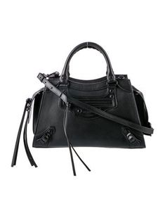 Balenciaga Top Handle BagFrom the Fall/Winter 2020 Collection by Demna GvasaliaBlack LeatherTonal HardwareRolled Handles & Single Shoulder StrapSingle Exterior PocketLeather Lining & Single Interior PocketZip Closure at TopIncludes Dust BagUnfortunately, due to restrictions, this item may not be eligible for shipping in all areas. Designer Black Bags For Winter, Designer Black Bag For Fall, Daily Use Bags With Branded Hardware For Fall, Black Satchel For Fall, Black Bags With Branded Hardware For Fall, Fall Black Bags With Branded Hardware, Black Shoulder Bag With Branded Hardware For Fall, Fall Shoulder Bag With Branded Hardware In Black, Balenciaga Top