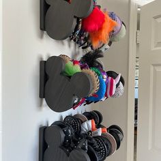 mickey mouse shoes are hanging on the wall