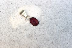 A simple, rare and one of a kind handcrafted pendant showcasing a beautiful red Ruby. All handmade with Sterling Silver .925. The pendant is approximately 19mm L X 10mm W. Minimalist Red Oval Jewelry, Red Sterling Silver Oval Cabochon Jewelry, Handmade Red Oval Cabochon Jewelry, Red Oval Pendant Jewelry With Polished Finish, Star Ruby, Purple Labradorite, Lemon Quartz, Oval Pendant, Red Ruby