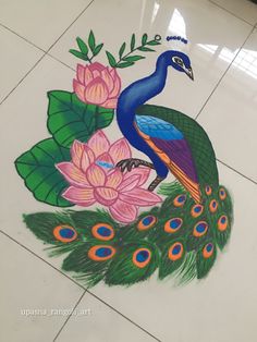 a peacock sitting on top of a white tile floor next to pink flowers and green leaves