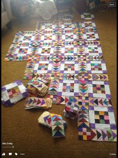 the quilts are laid out on the floor