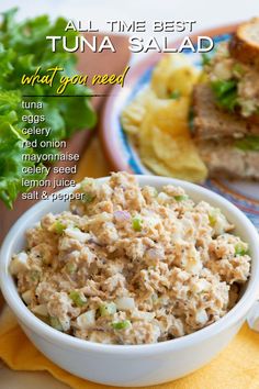 tuna salad in a white bowl with lettuce and pineapple on the side