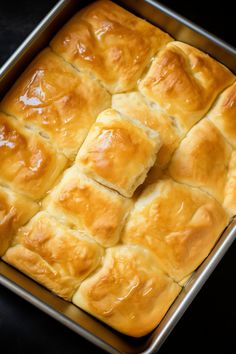 a pan filled with bread sitting on top of a table