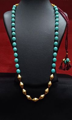 Silver Gold plated Turquoise Dholki Necklace- Long Beaded Blue Necklace- Handmade Indian Jewelry for women- Gemstone bollywood necklace-Gift Dholki Beads Silver Necklace with semiprecious beads. Length 24 inches + extra thread to increase length Disclaimer-This necklace is made of Dholki silver beads that are wax filled. Thus it comes without 925 Silver Hallmarking. Hallmarking process involves the application of a strong force to engrave on the metal, and the dholki beads may get disfigured, due to their intricate craftsmanship. Festival Necklaces With Latkans And Round Beads, Festival Round Beads Necklaces With Latkans, Turquoise Jewelry With Latkans For Festivals, Diwali Necklaces With Round Beads And Latkans, Festive Blue Necklaces With Round Beads, Traditional Turquoise Jewelry With Latkans, Festive Blue Gemstone Bead Jewelry, Turquoise Latkans Jewelry For Festivals, Diwali Necklaces With Latkans And Round Beads