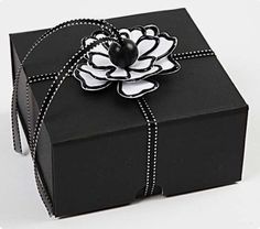 a black and white box with a flower on it