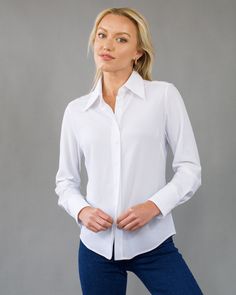 The Bubble Blouse offers women lightweight, breathable, easy-care comfort in a sophisticated style. A looser fit blouse with a stylish collar and 3-button cuff. Compact, light, and soft, with two-way stretch. Made with Renew Bubble fabric, this blouse has a unique mesh texture, delicate feel, comfortable stretch and is fast drying. Feels like a veil on the skin. All Luxeire garments require no dry-cleaning with natural wrinkle release. Colors: black, white Ultra lightweight, breathable, thermore Bubble Fabric, Mesh Texture, Wrinkle Release, Full Length Coat, Loose Fit Blouse, Clare V., The Bubble, Italian Fabric, City Style