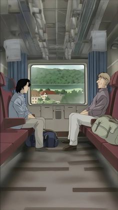 two people sitting in seats on a train