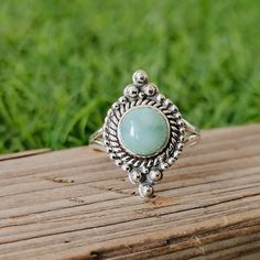 NOTE : WE USED NATURAL GEMSTONES , SO STONE MAY BE LITTLE DIFFERENT .This is a listing of Boho sterling silver ring # Material = Sterling silver 925 # Gemstone - Larimar # Ring Size - Available in all Size # Stone Color - Skyblue # Stone Shape - Round Handmade Crafting bohemian Ring - This style has bohemian style . it will look beautiful when you wear it .. Thanks for visiting our shop ... favorite our shop for daily updates ... Stamped 925 Larimar Rings As A Gift, Silver Larimar Promise Ring, Silver Larimar Ring Stamped 925, Round Larimar Rings As A Gift, Turquoise Larimar Round Ring, Handmade Blue Turquoise Larimar Ring, Elegant Blue Larimar Rings, Unique Silver Larimar Rings, Adjustable Blue Larimar Ring