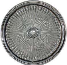 an image of a chrome plate with spokes on the front and center wheel rim