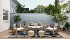 an outdoor living area with furniture and plants