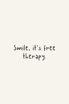 the words smile, it's free therapy written in black ink on a white background