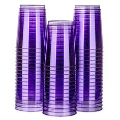 three purple vases sitting next to each other