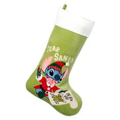 a green christmas stocking with an image of a cartoon character on it and the words dear santa