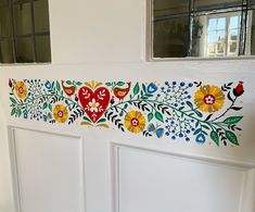 the painted door is decorated with flowers and hearts