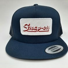 Brand new high-quality embroidered patch on a flat bill mesh trucker snapback cap hat blue Retro Embroidered Snapback Baseball Cap, Blue Snapback Baseball Cap With Embroidered Patch, Trucker Snapback Hat With Letter Patch, Blue Snapback Hat With Embroidered Patch, Blue Snapback Hat With Logo Patch, Blue Embroidered Snapback Baseball Cap, Blue Snapback Trucker Hat With Embroidered Patch, Blue Embroidered Snapback Trucker Hat, Blue Trucker Snapback Hat With Logo Patch