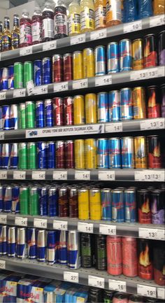 the shelves are filled with many different types of cans