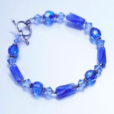 "7\", vintage Sterling 925 silver bracelet with blue crystal beads and toggle closure, silver tested" Blue Crystal Bracelet With Silver Beads, Blue Nickel-free Crystal Bracelet For Gift, Blue Nickel-free Crystal Bracelet Gift, Elegant Blue Crystal Bracelet With Silver Beads, Elegant Blue Faceted Crystal Bracelet, Nickel-free Blue Sterling Silver Bracelet As A Gift, Blue Beaded Crystal Bracelet In Sterling Silver, Blue Sterling Silver Beaded Bracelets With Faceted Beads, Vintage Blue Sterling Silver Bracelet