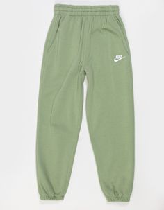 Nike Sportswear Club Oversized Fleece Joggers. Extra Room Through The Legs Gives These Oversized Pants A Relaxed, Oh-So-Cozy Feel. Smooth On The Outside, Brushed Soft On The Inside, This Lightweight Fleece Is An Easy Layer When You Want A Little Extra Warmth. So Whether You're Running Circles Around Your Friends At Recess Or Running Late To Practice, These Sweats Give You The Space You Need To Feel Comfy, Relaxed And Ready For Whatever Comes Next. Angled Pockets Make It Easy For You To Store Your Stuff And Get Back To Playing. Tighten Up The Waist On The Fly With The Quick-Tie Drawcord. 3-Channel Waistband. Embroidered Futura Logo. 80% Cotton, 20% Polyester. Machine Wash. Imported. | Nike Sportswear Club Girls Oversized Fleece Joggers Sporty Green Winter Bottoms, Green Sporty Winter Bottoms, Sporty Green Bottoms For Winter, Green Winter Sweatpants With Elastic Waistband, Winter Green Sweatpants With Elastic Waistband, Green Sweatpants With Elastic Waistband For Winter, Green Joggers With Elastic Waistband For Winter, Sporty Green Joggers For Fall, Athleisure Nike Sweatpants