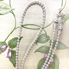 pearl bead glasses chain silver beads between each pearl rubber loops cinch around your glasses Metal Bead, Eyeglass Chain, Stretch Bands, Glasses Chain, Metal Beads, Chain Lengths, Pearl White, Chain Necklace, Best Gifts