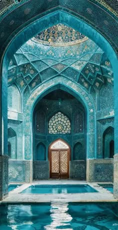 the inside of an ornate building with a pool in front of it and blue tiles on the walls