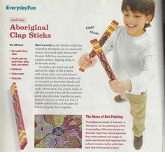 an advertisement for children's toothbrushes featuring a boy holding two colorful sticks