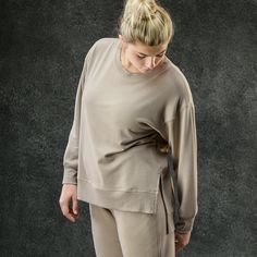 This insanely soft top is a core staple of the Essential Collection and is made from a dreamy modal fleece, which allows for moisture-wicking & next-level comfort. The midweight design and relaxed fit offer more freedom of movement, and when you’re this cozy, it’ll have you lounging all day. Oversized Sweatshirt For Relaxation, Versatile Cotton Sweatshirt For Loungewear, Cotton Athleisure Tops With Soft Texture, Relaxed Fit Spring Activewear For Relaxation, Relaxed Fit Activewear For Spring Relaxation, Oversized Athleisure Sweatshirt For Relaxation, Comfy Tops With Ribbed Cuffs For Casual Wear, Comfy Tops With Ribbed Cuffs, Versatile Relaxed Fit Activewear For Loungewear