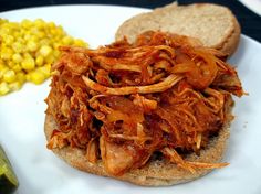 pulled pork sandwich with corn on the cob