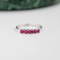 A stacking 5 stone ruby ring in 14K solid rose gold. It is ideal for anniversary gift for women or for an alternative wedding band. This ruby cluster ring can be also used as a Christmas Gift. Also, ruby is the July birthstone. 100% handcrafted with love! PRODUCT DETAILS ● Material : 14K solid gold - white gold - rose gold ● Gemstones: 5 Rubies natural ● Ruby's Diameter: 2.5mm ● Rubies Weight: 0.41ct ● Gemstones shape: Round/ Brilliant cut RING SIZING For General Reference: ● we use standard US Formal Ruby Stackable Rings, Ruby Stackable Promise Ring, Fine Jewelry Stackable Ruby Promise Ring, Fine Jewelry Ruby Half Eternity Ring For Anniversary, Ruby Ring With Prong Setting For Anniversary, Stackable Ruby Promise Ring With Round Cut, Stackable Ruby Ring For Formal Occasions, Classic Ruby Half Eternity Ring As Gift, Classic Half Eternity Ruby Ring Gift