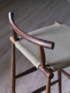 a wooden chair sitting on top of a hard wood floor