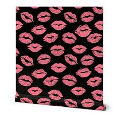 a black and pink wallpaper with red lipstick on it's lips in the shape of kisses