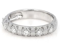 a white gold wedding band with diamonds