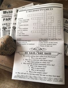 two crosswords are sitting next to a rock on top of some paper with the words he said she said