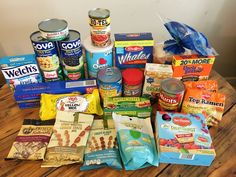 an assortment of food items on a wooden table