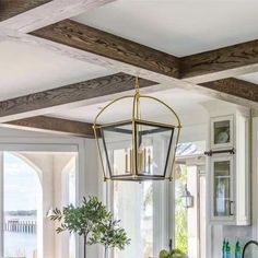 a kitchen filled with lots of counter top space next to a dining room table and chairs