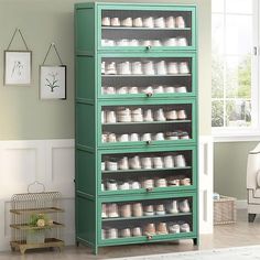 a green cabinet with many jars on it