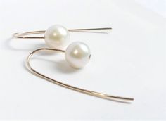 "Lustrous white freshwater pearls set in 14k gold filled hand forged hooks with longer ear wire at the back. Simple, modern, minimal yet classic pearl earrings, great for everyday wear as well. - Pearls are approx. 7.5mm - 8mm, near round, with high luster and smooth surface ( very minor natural imperfection ). - Earrings measure 3/4\" ( 1.9cm ) from top of the hook to end of the pearl, 1 & 3/8\" ( 3.5cm ) overall in length. - Length options: 1 & 3/8\" ( 3.5cm ) as shown, 1 & 3/4\" ( Elegant Jewelry With Fish Hook For Gift, Elegant Gold Jewelry With Fish Hook, Elegant Fish Hook Jewelry For Formal Occasions, Forged Hooks, Classic Pearl Earrings, Pebble Jewelry, Ivory Earrings, Simple Pearl, Gold Filled Hoops